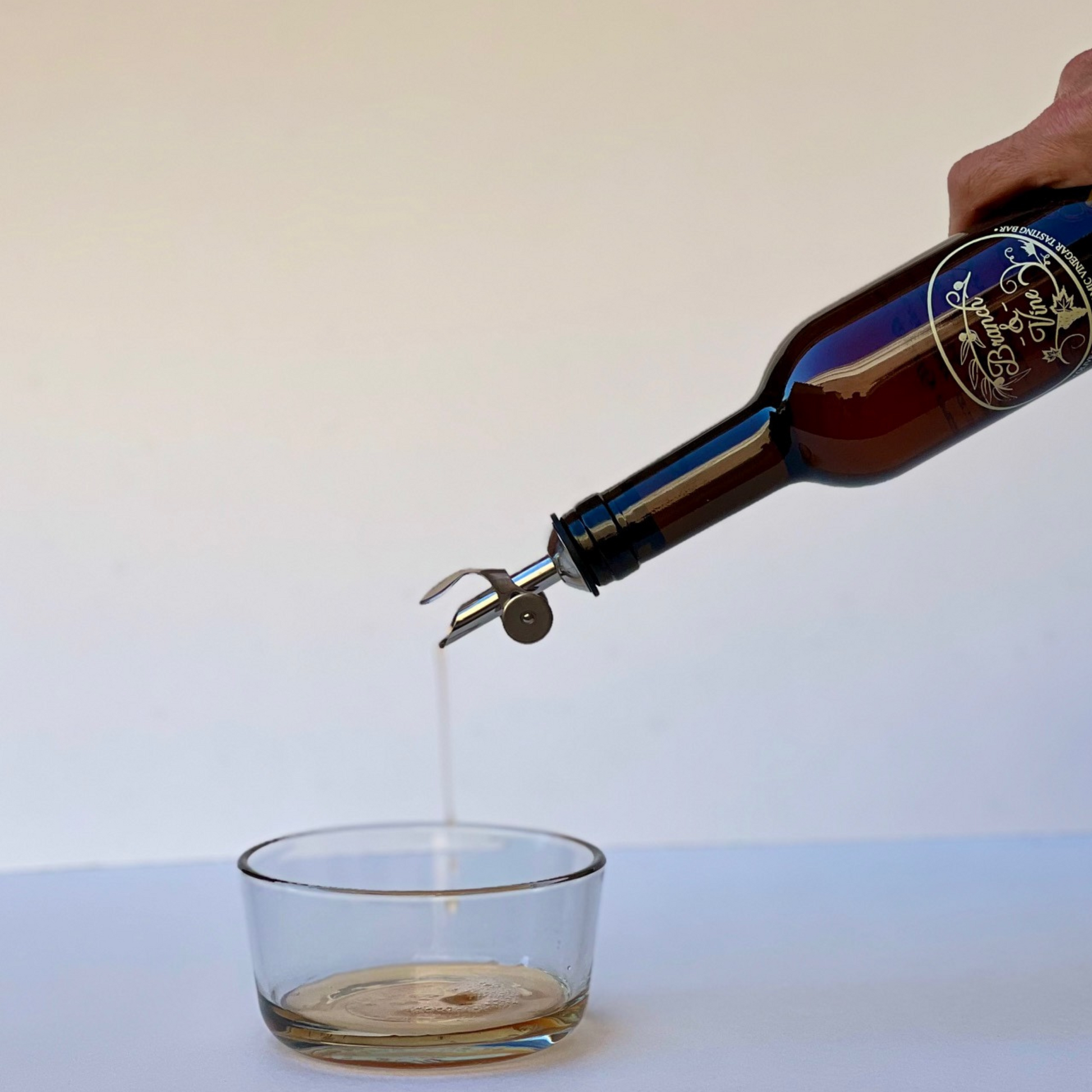 Branch and Vine White Balsamic Vinegar pouring into a bowl